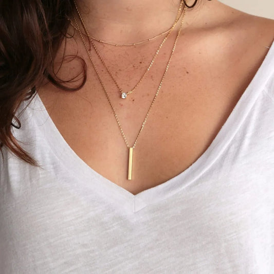 3 cadenas de oro laminado con 2 dijes